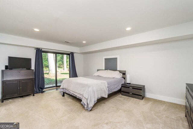 carpeted bedroom with access to outside