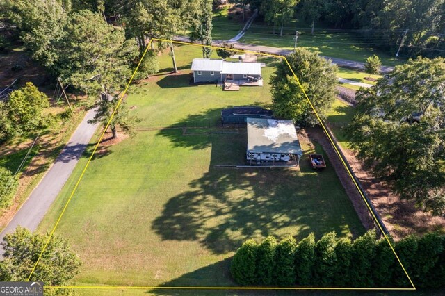 birds eye view of property with a rural view