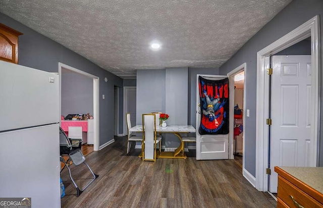 office featuring a textured ceiling and dark hardwood / wood-style flooring