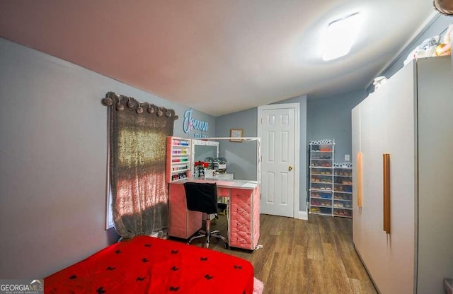 office area with lofted ceiling and hardwood / wood-style floors