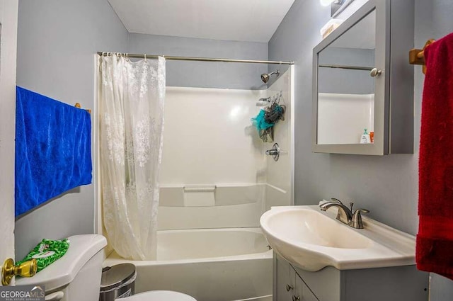 full bathroom featuring vanity, toilet, and shower / tub combo