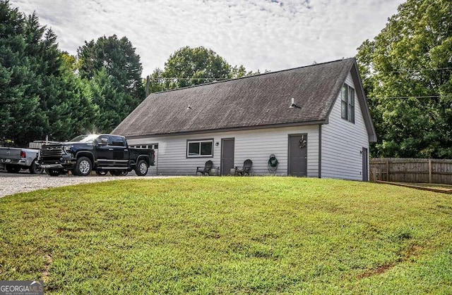 view of side of home with a lawn