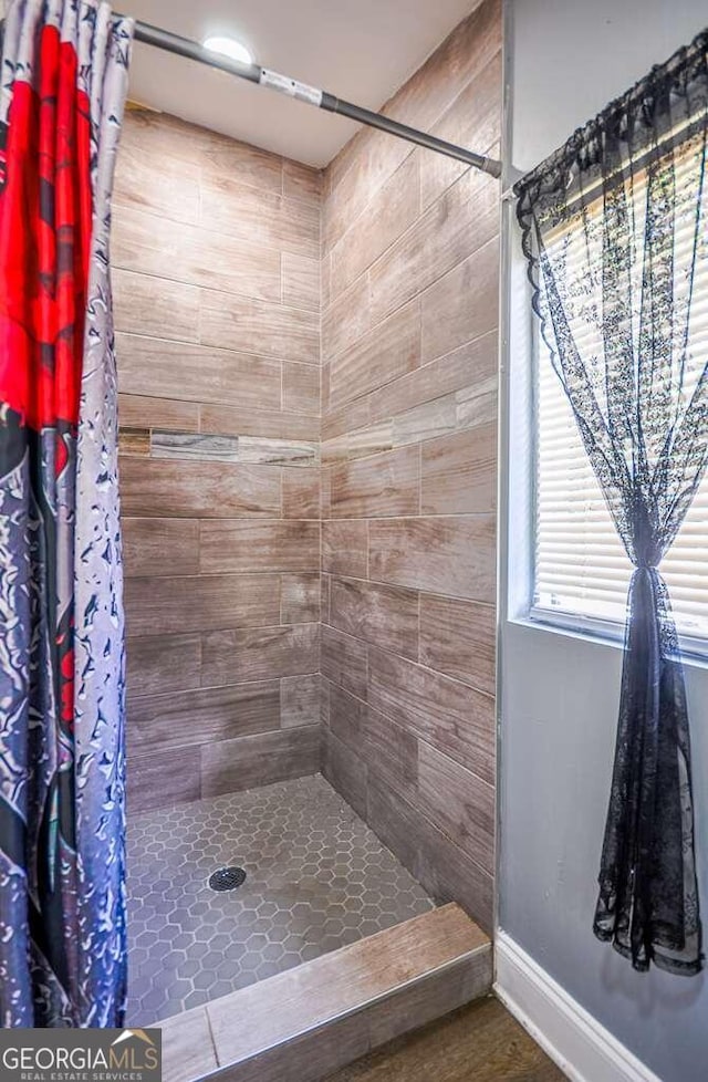 bathroom with a shower with shower curtain