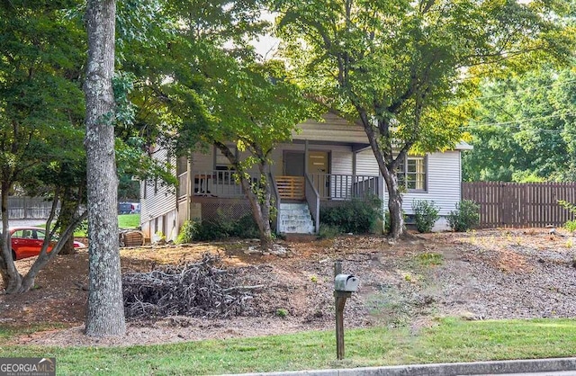 obstructed view of property with covered porch