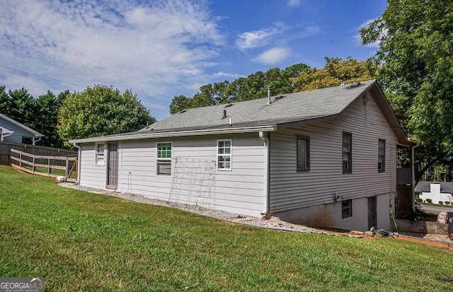 view of home's exterior with a yard