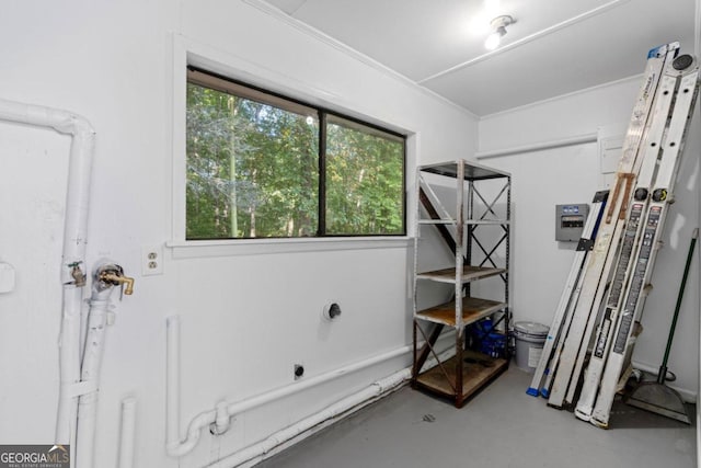 interior space with crown molding and concrete floors