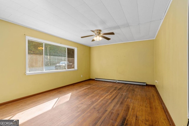 empty room featuring ornamental molding, baseboard heating, hardwood / wood-style floors, and ceiling fan