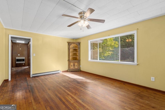 empty room with hardwood / wood-style floors, ceiling fan, baseboard heating, and heating unit