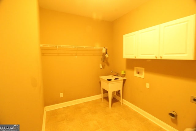 laundry room with cabinets, washer hookup, and hookup for an electric dryer