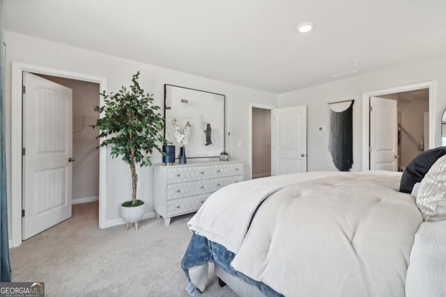 bedroom with light colored carpet