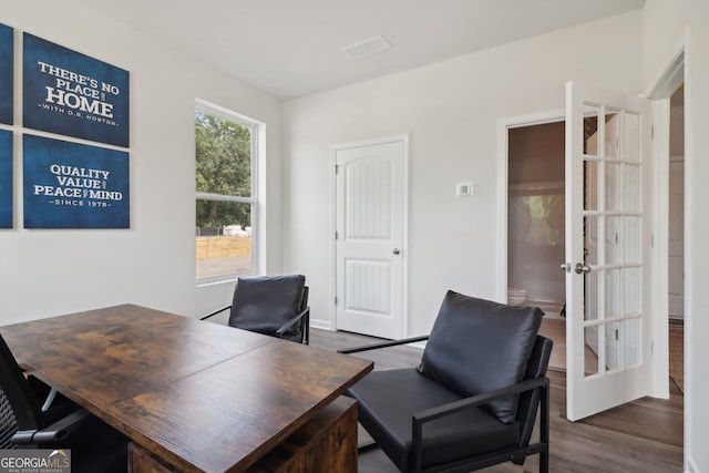 home office featuring dark wood-type flooring and french doors