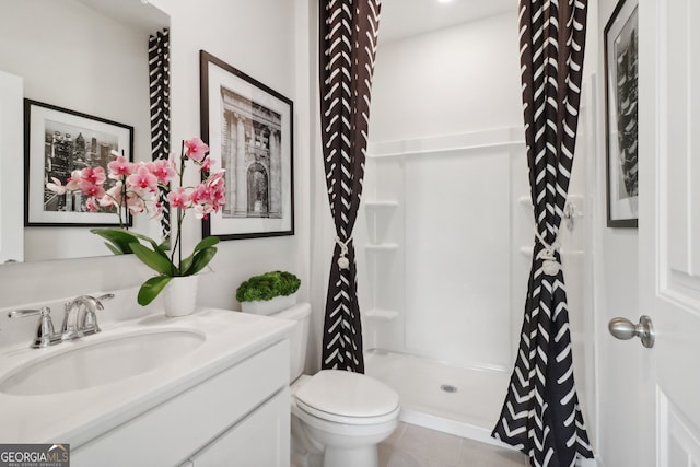 bathroom featuring vanity, a shower with curtain, toilet, and tile patterned flooring