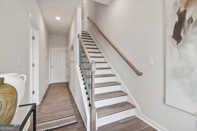 staircase featuring hardwood / wood-style floors