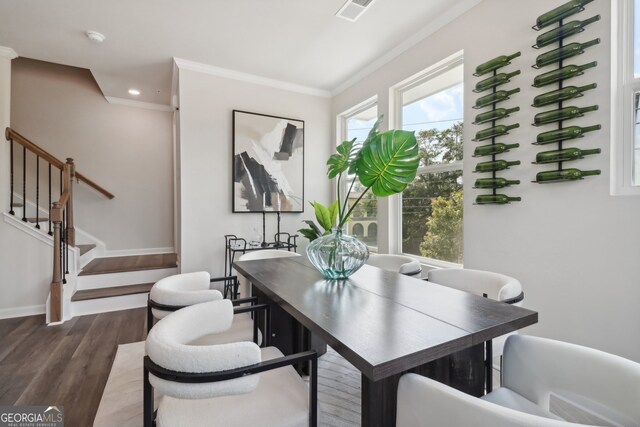 home office featuring ornamental molding and dark hardwood / wood-style floors