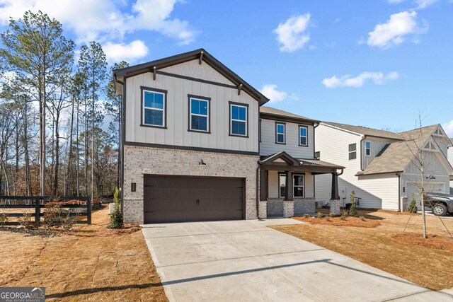 view of front of home with a garage and a front yard