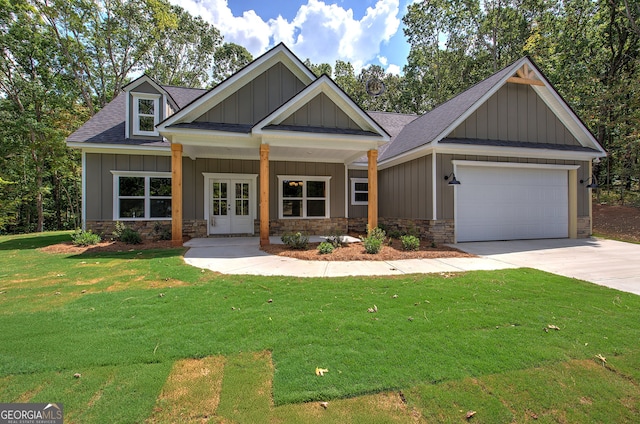 craftsman inspired home featuring a garage and a front yard