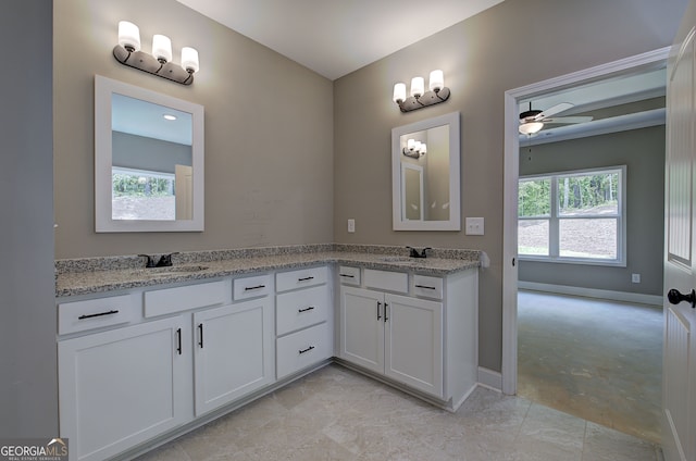 bathroom with plenty of natural light, vanity, and ceiling fan