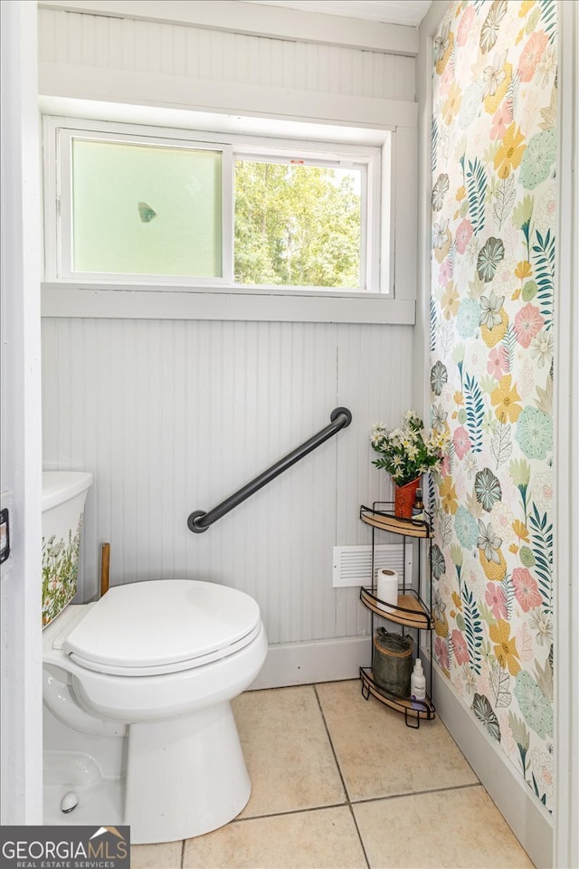 bathroom featuring toilet and tile patterned floors