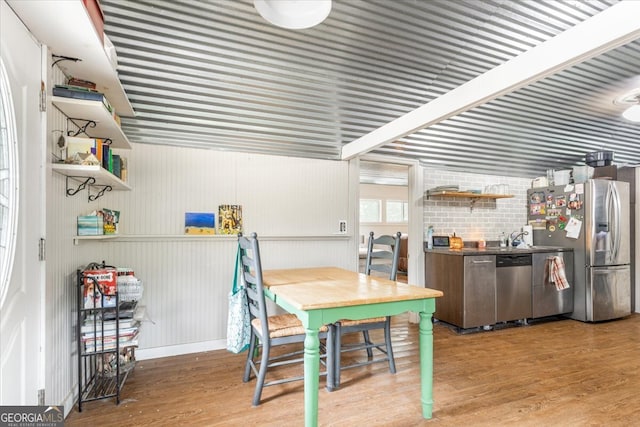 dining room with wood-type flooring