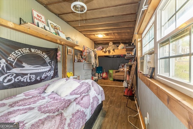 bedroom featuring cooling unit and dark hardwood / wood-style flooring