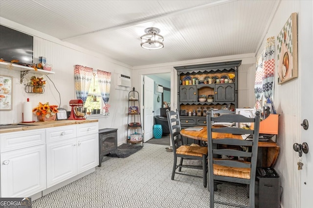 dining space with a wall mounted AC