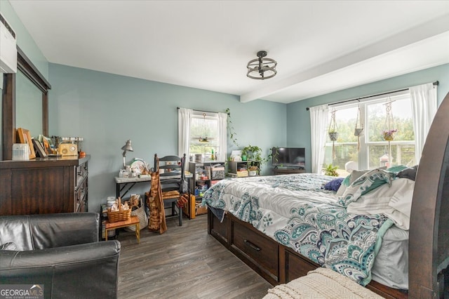 bedroom with dark wood-type flooring