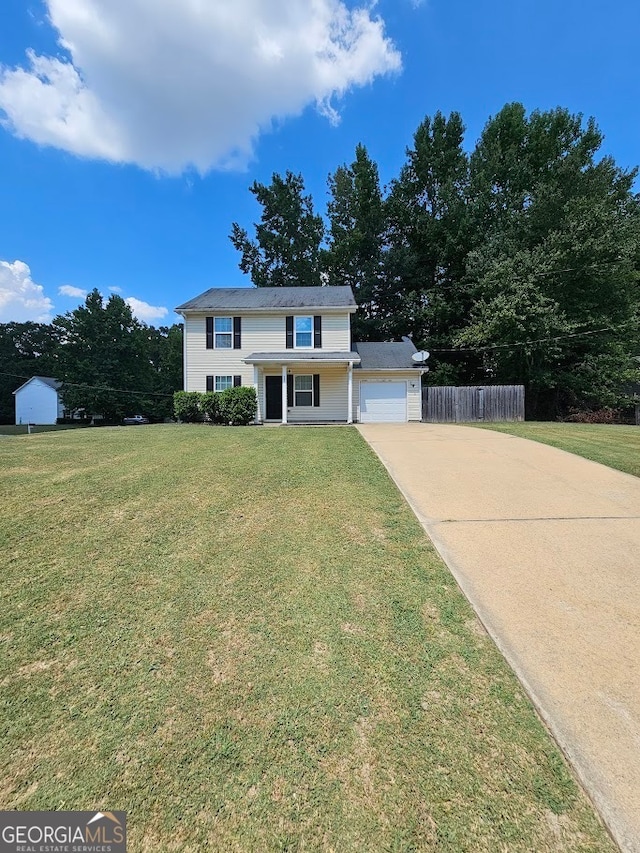 view of front facade featuring a garage and a front lawn