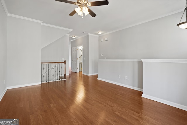 unfurnished living room featuring crown molding, ceiling fan, and hardwood / wood-style flooring