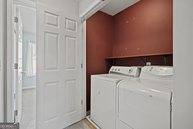 washroom with light carpet and washer and clothes dryer