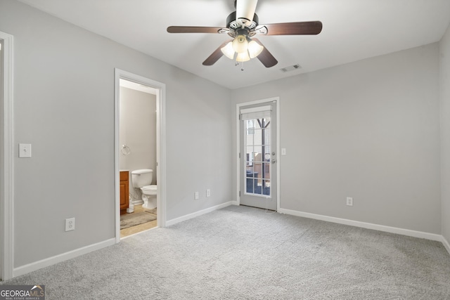 unfurnished bedroom featuring connected bathroom, ceiling fan, and light colored carpet