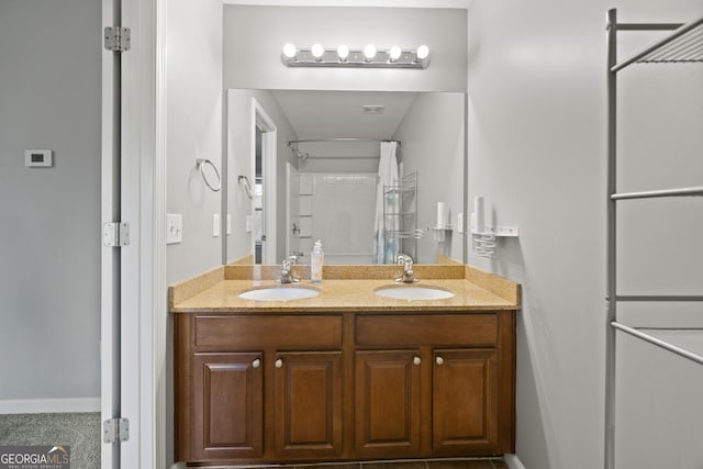 bathroom with vanity and walk in shower