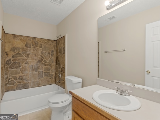 full bathroom featuring a textured ceiling, vanity, tile patterned flooring, toilet, and shower / bath combination