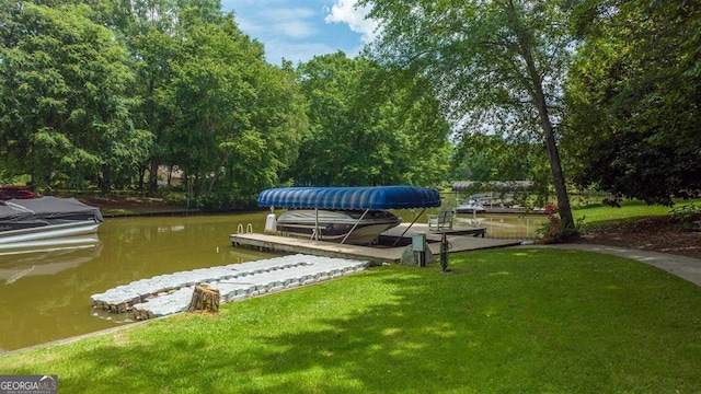 view of dock featuring a yard and a water view