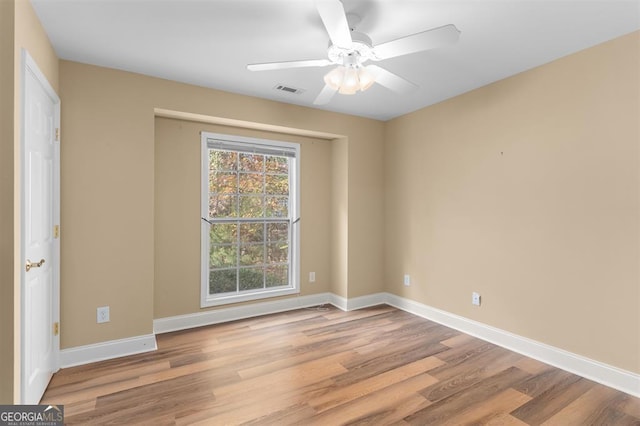 unfurnished room with ceiling fan and light hardwood / wood-style flooring