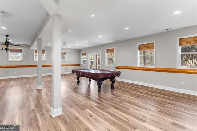 recreation room featuring plenty of natural light and light hardwood / wood-style floors