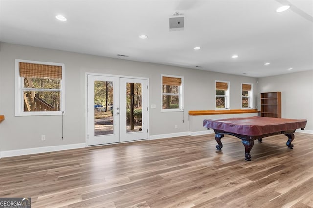 playroom with hardwood / wood-style floors, a healthy amount of sunlight, and billiards