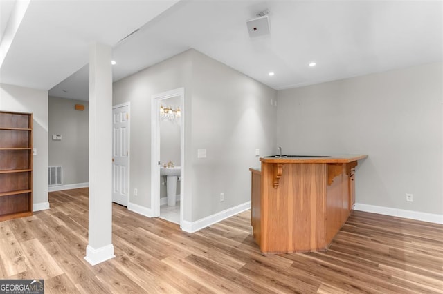 bar featuring hardwood / wood-style flooring