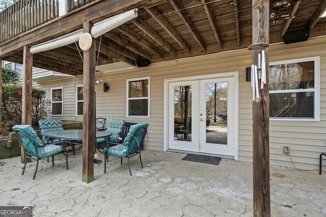 view of patio featuring french doors and a balcony