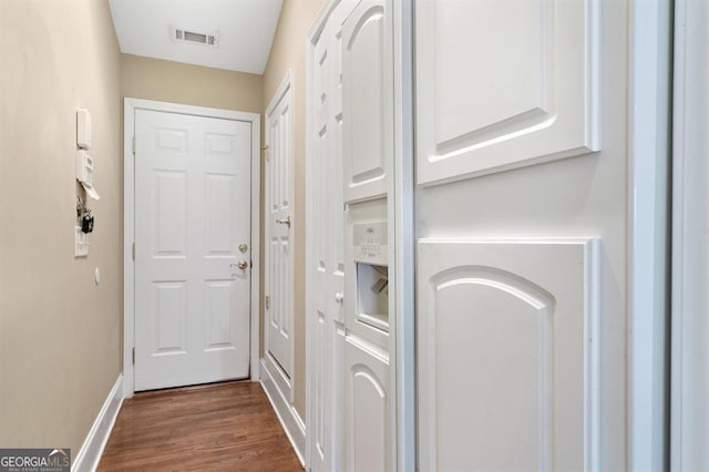 doorway to outside featuring dark hardwood / wood-style floors