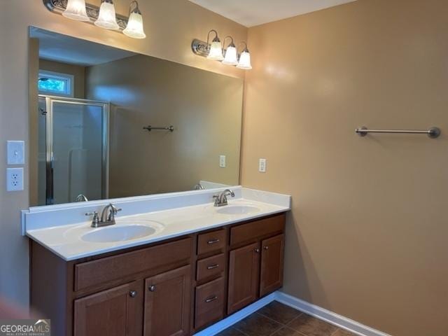 bathroom featuring tile patterned flooring, walk in shower, and vanity