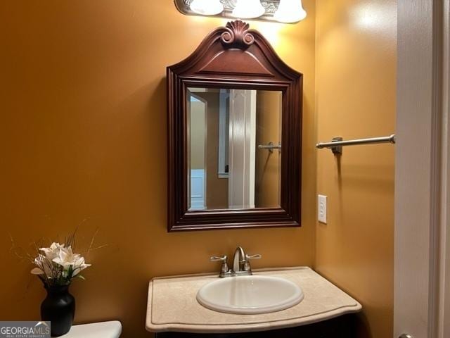 bathroom featuring toilet and sink