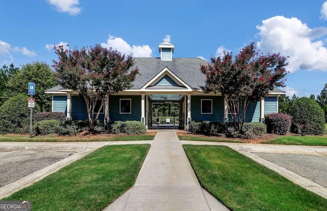 view of front of home with a front lawn