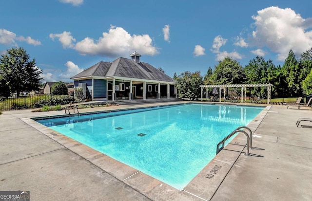 view of swimming pool with a pergola