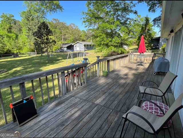 wooden terrace with a yard