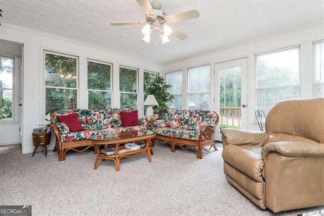 sunroom / solarium with plenty of natural light and ceiling fan