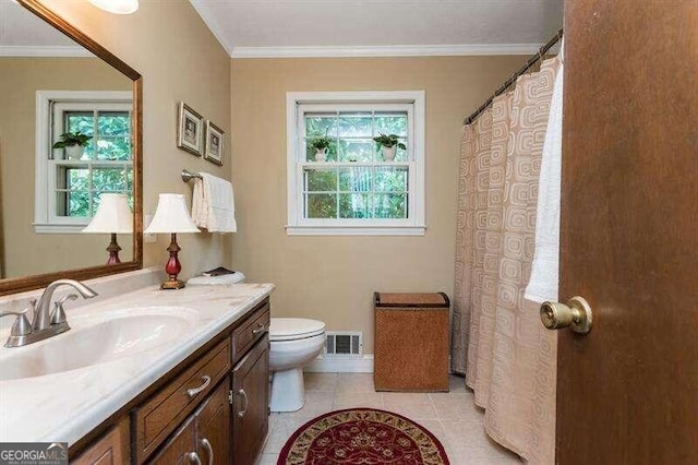 bathroom featuring crown molding, vanity, toilet, and tile patterned floors