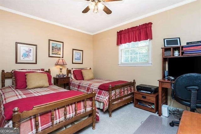 carpeted bedroom with ceiling fan and ornamental molding