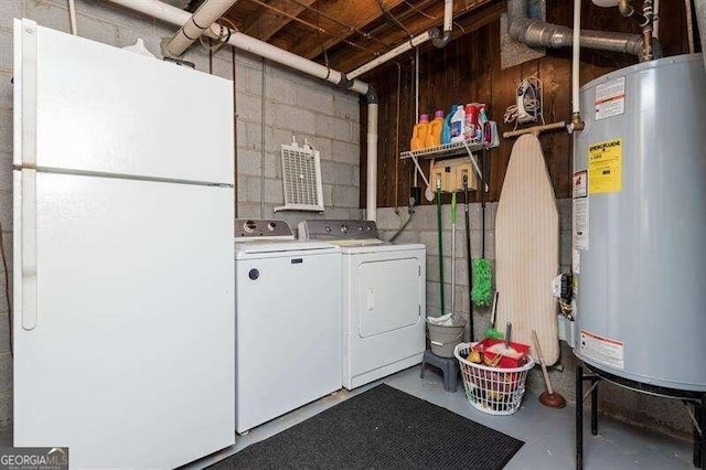 laundry room featuring washing machine and clothes dryer and gas water heater