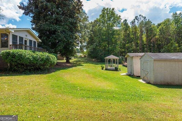 view of yard featuring a storage shed and a gazebo