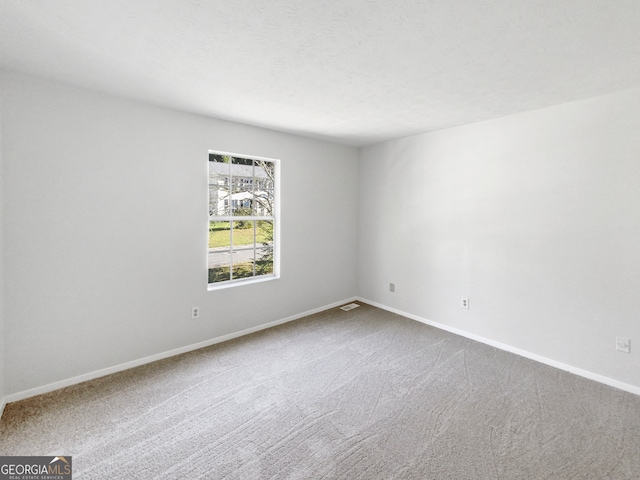 spare room with carpet flooring